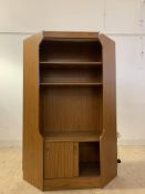 A mid century teak veneered corner unit, with illuminated interior, two shelves and sliding cupboard