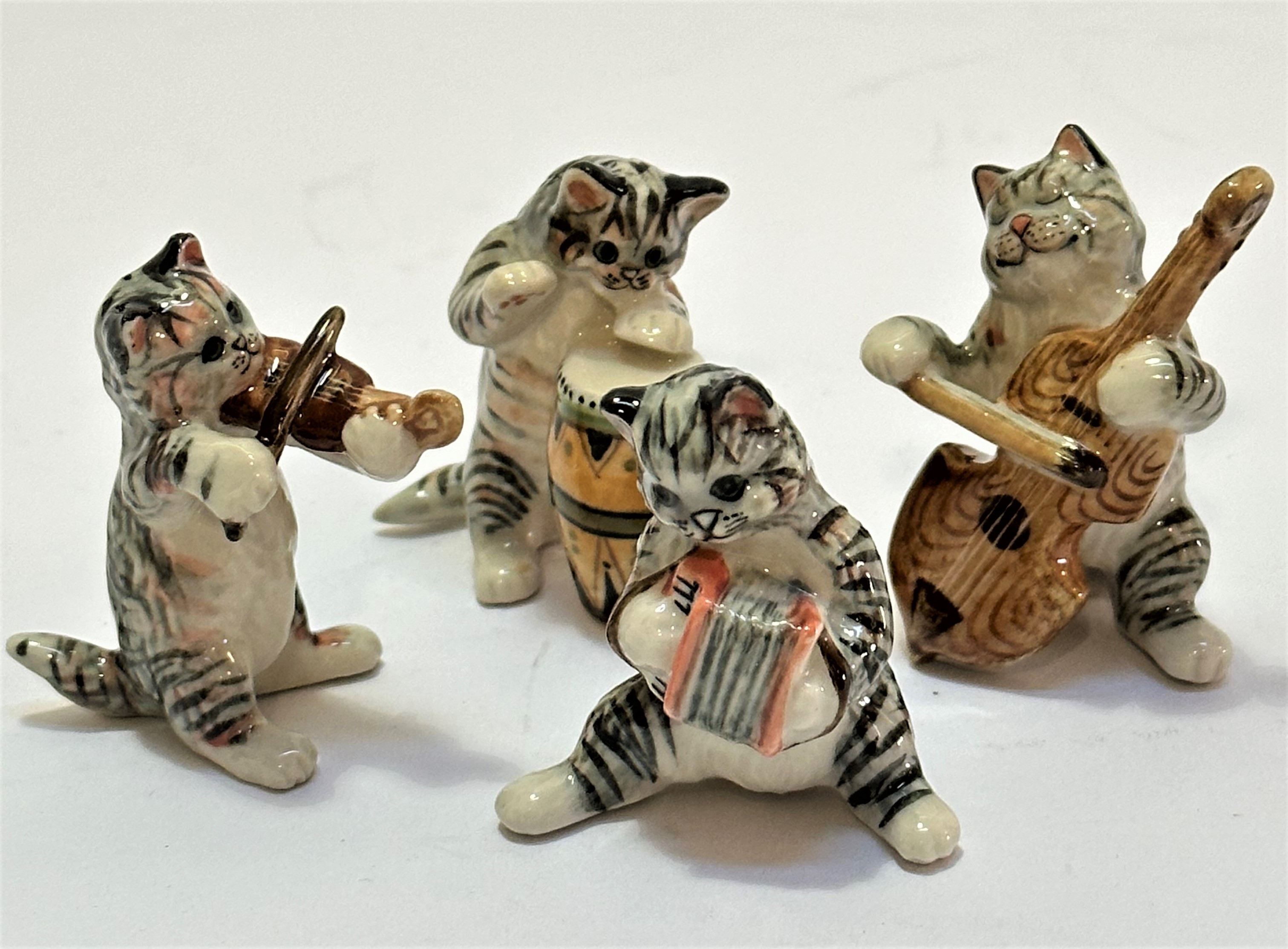 A Kyd ceramic miniature tabby cat band including bass player, according, drum and violin player, (