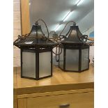A pair of Edwardian style hammered octagonal hall lanterns of Pagoda form, one lacking ceiling rose,