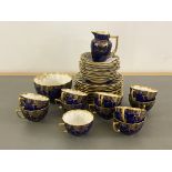 An Aynsley china blue and gilt part tea service, comprising 11 cups, 12 saucers, 12 side plate, milk