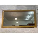 A large contemporary oak framed wall hanging mirror, with bevelled plate 169cm x 90cm