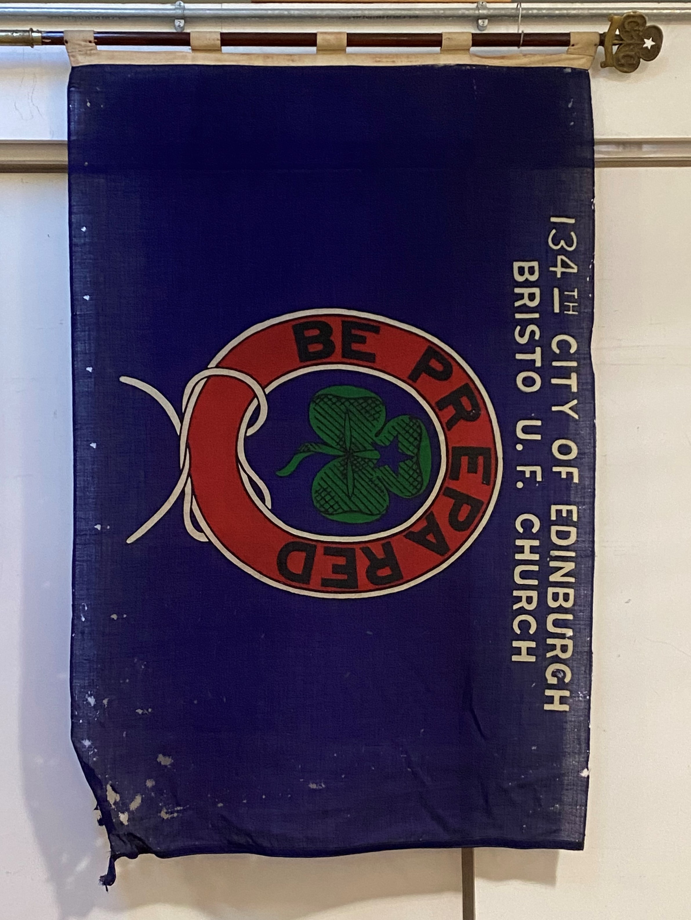 Girl Guides flag, topped with cast brass Guides badge, the flag of printed cotton 134th CITY OF
