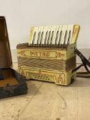 A Pietro bellows-driven accordion, in leather case, W34cm