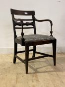 A Regency mahogany elbow chair, the moulded crest rail over reeded and wheat sheaf carved bar