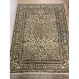 A fine hand knotted carpet from the kashan region, the ivory field with medallion, spandrels and