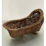 A 1920s wicker baby style / dolls cradle with handmade lattice border, on treen rockers, (30 x 53