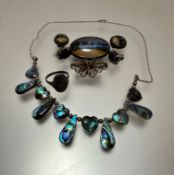 An abalone shell white metal mounted necklace with thongs and heart shaped panels, butterfly wing