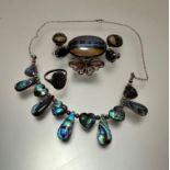 An abalone shell white metal mounted necklace with thongs and heart shaped panels, butterfly wing