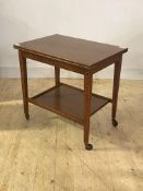 An early 20th century oak card table, the fold over revolving top revealing a baize lined playing