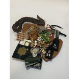 Mixed lot of cap badges, buttons, ribbon bars, German Epaulettes, cartridge belt and two wooden
