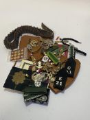 Mixed lot of cap badges, buttons, ribbon bars, German Epaulettes, cartridge belt and two wooden