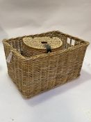 A wicker basket of rectangular form with carry handle to each side together with a wicker lidded