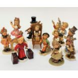 A collection of German Hummel pottery figures including The Bell Hop condiment figure with Excelsior