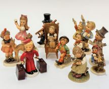 A collection of German Hummel pottery figures including The Bell Hop condiment figure with Excelsior