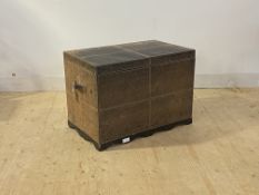 A leather covered blanket box with hinged lid and carry handle to each end, H55cm, W80cm, D47cm