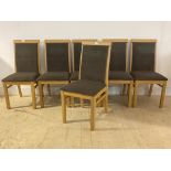 A set of six contemporary oak dining chairs with upholstered seats and backs, H98cm, W37cm, D52cm