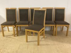 A set of six contemporary oak dining chairs with upholstered seats and backs, H98cm, W37cm, D52cm