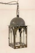 An Art Nouveau style hammered copper hanging hall lantern, one glass panel a/f H47cm