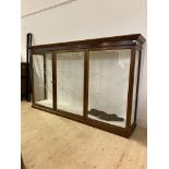 Edwardian mahogany museum/ shop display cabinet, with three glazed doors enclosing six glass