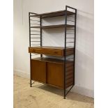 Staples Ladderax, a mid century teak modular wall unit, with two adjustable shelves over drawer