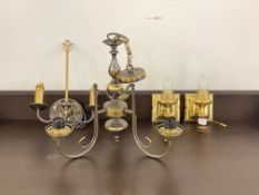 A cast metal three branch chandlelier, (H49cm) together with a twin branch wall sconce (H40cm) and a