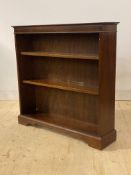 A Victorian style mahogany open bookcase fitted with two adjustable shelves, H92cm, W95cm, D23cm