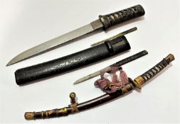 A Japanese Tanto with treen carved scabbard with bamboo bound grip with shark skin, (35cm, blade
