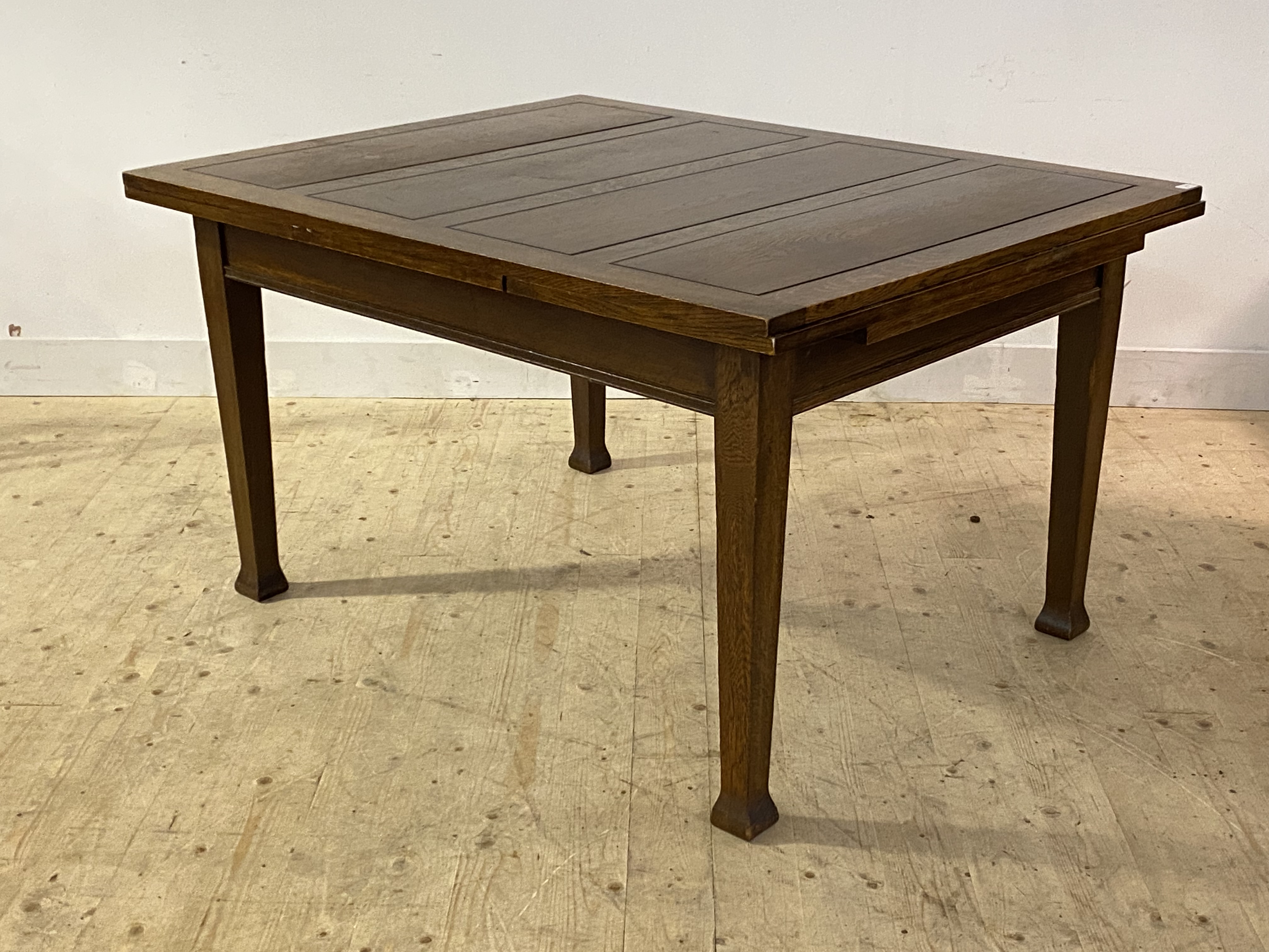 An oak Arts and Crafts duo drawer leaf dining table, the panelled rectangular top raised on square - Image 3 of 3