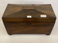 A 19th century rosewood tea caddy, of sarcophagus form, the hinged lid opening to a void interior,