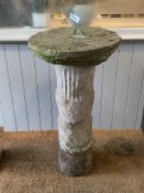 A 19th century carved sandstone sundial, the circular top with copper pointer standing on a