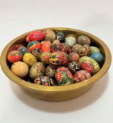 A large Eastern brass food serving dish, (9cm x 36cm) containing a collection of polished agate