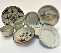 Four various Highland stoneware bowls, one decorated with floral design, one with blue floral and