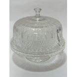 A large moulded glass cake stand and domed cover complete with knop, (30cm x 30cm), on spreading