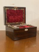 A 19th century rosewood and mother of pearl inlaid vanity box, the top lifting to reveal a toilet