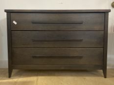 Andrew Martin, a stained wood chest, fitted with three drawers, raised on square tapered supports,