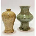 A Chinese pale green celadon ware baluster vase with craquelure decoration (two section repairs to