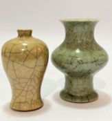 A Chinese pale green celadon ware baluster vase with craquelure decoration (two section repairs to