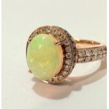 A Le Vian 14 ct strawberry gold Neapolitan opal and diamond dress ring, the oval cabuchon opal