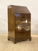 A 20th century mahogany bureau, the fall front revealing fitted interior and tooled leather