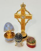 A Faberge style cross with mounted with Russian crown, with crystal set centre mounted on faux pearl