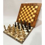 A marble chess board and a burr elm and sycamore chess board and a set of Don Quixote (h 11cm) and