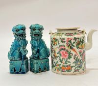 A pair of late 19th Century Chinese pottery Buddhistic lions with blue glaze (significant damage and
