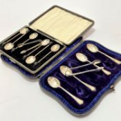 A Sheffield set of four silver teaspoons and pair of similar silver tongs in fitted case, a set of