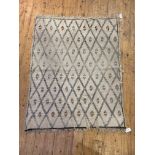 A Vintage Moroccan rug, the ivory ground with lozenge design, 157cm x 120cm