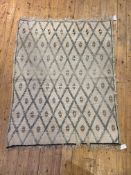 A Vintage Moroccan rug, the ivory ground with lozenge design, 157cm x 120cm