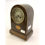 An Edwardian mahogany dome top mantel clock, the boxwood strung case inlaid with paterea, on a