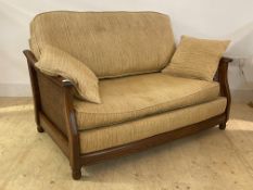 Ercol, a late 20th century stained elm framed two seat bergere sofa, with chinille upholstered squab
