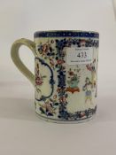 A 18th century Chinese export mug, with transfer printed blue borders and hand painted with figures,