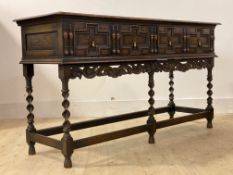 An oak dresser base or sideboard of 17th century design, circa 1930s, the top with moulded edge over