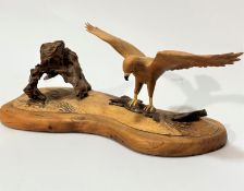 E Summers, Buzzard with Prey, elm, cherry and root wood, (15cm x 35cm x 14cm), signed verso and